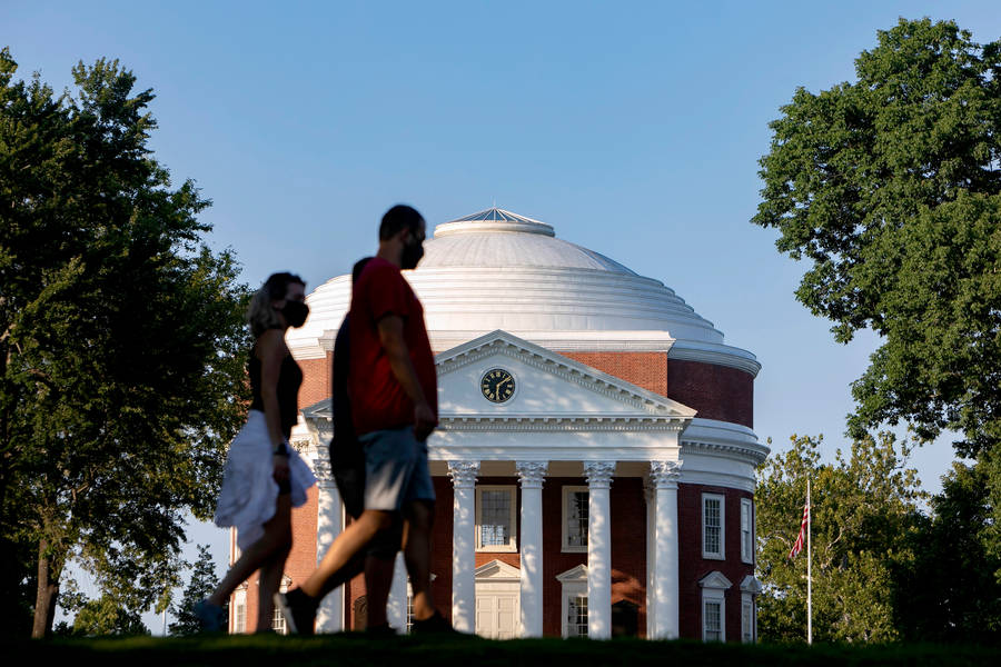 Students Bustling By The Historic Rotunda At The University Of Virginia Wallpaper