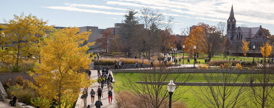 Students Walking On A Pathway At University Of Massachusetts Wallpaper