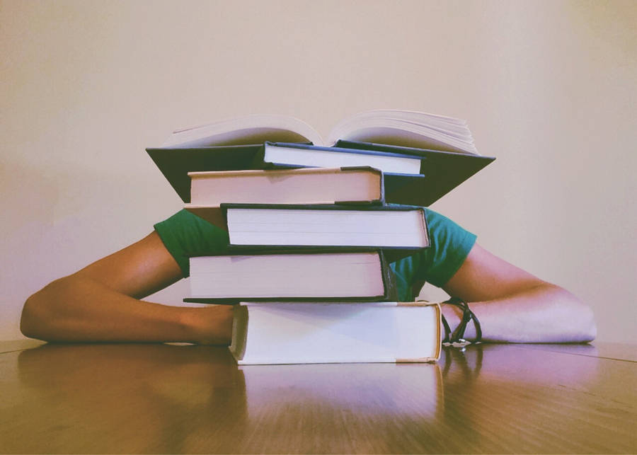 Study Motivation Tall Stack Of Books On Table Wallpaper