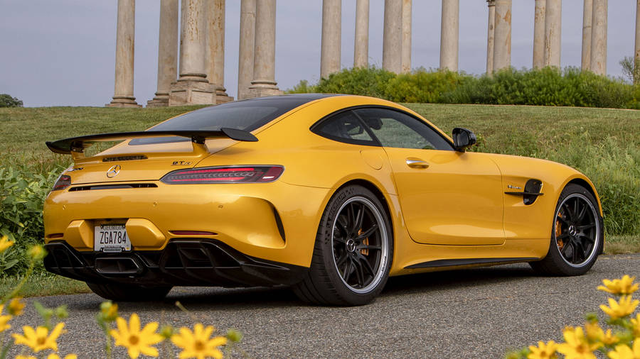 Stunning Amg Gtr Parked Amidst Classic Architecture Wallpaper