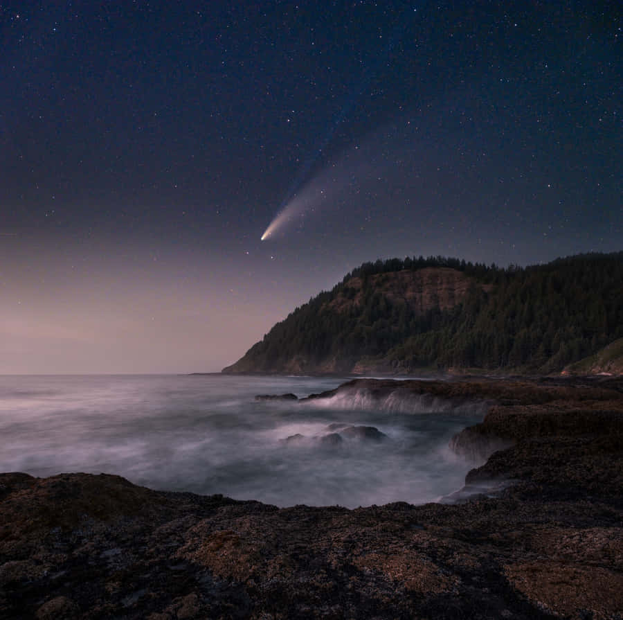 Stunning Comet Illuminating The Night Sky Wallpaper