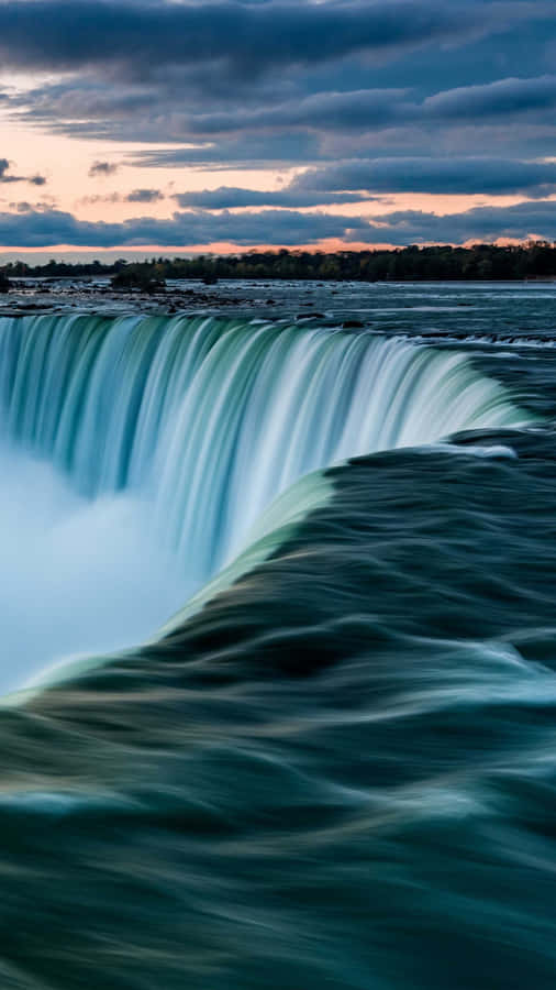 Stunning Iphone Wallpaper Of A Majestic Waterfall Wallpaper