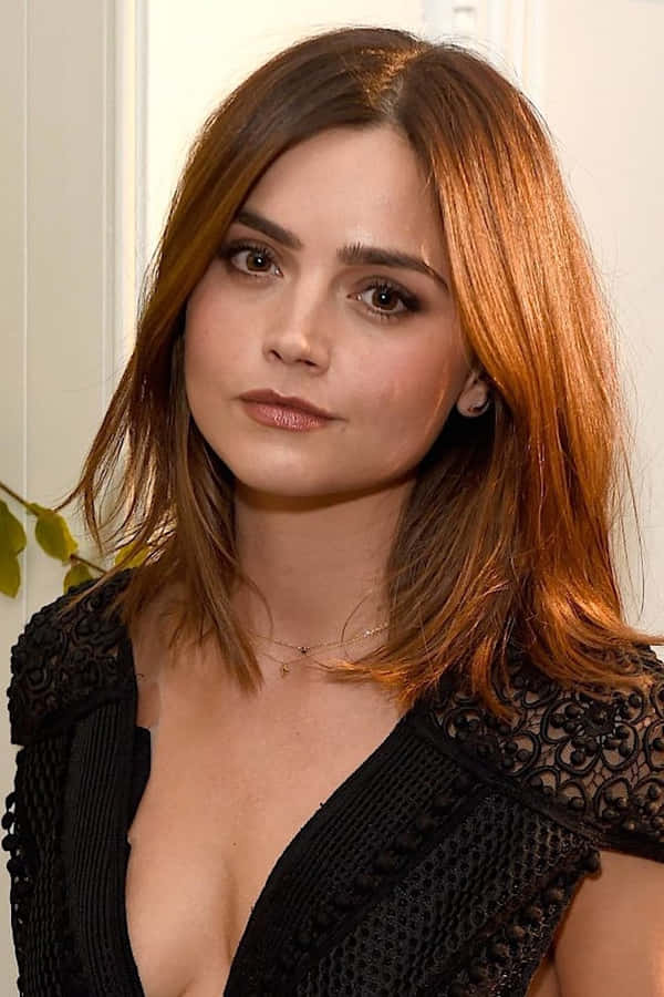 Stunning Jenna Coleman Posing Elegantly Wallpaper