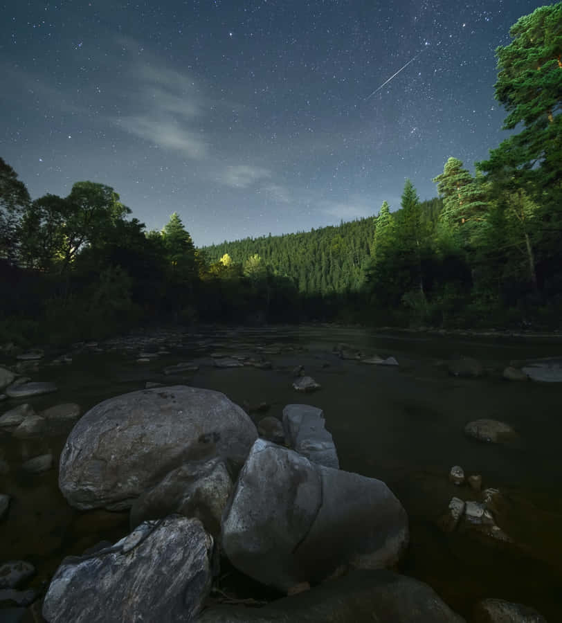 Stunning Meteor Shower In Night Sky Wallpaper