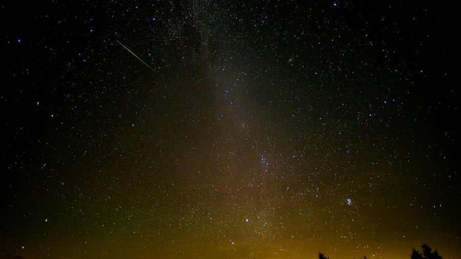 Stunning Meteor Shower In Night Sky Wallpaper