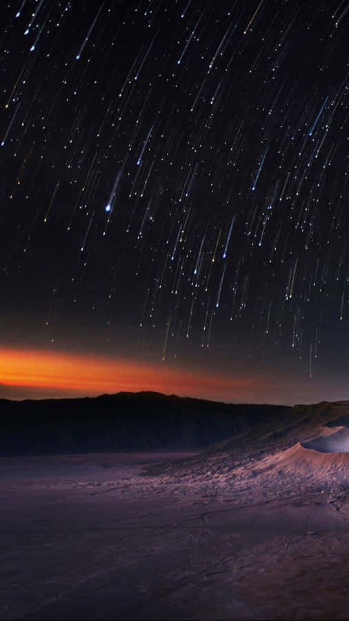 Stunning Meteor Shower In The Night Sky Wallpaper