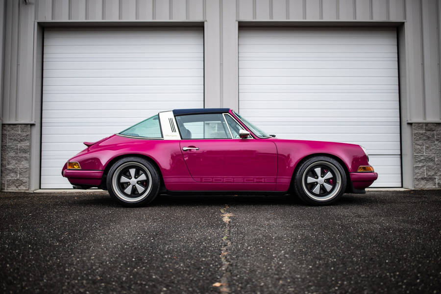 Stunning Raspberry Singer Porsche 911 In Motion Wallpaper