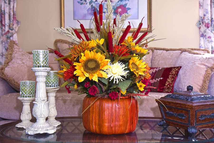 Stunning Red And Yellow Flowers In A Vase Wallpaper