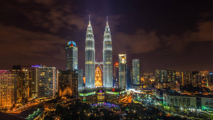 Stunning View Of Petronas Towers At Night, Kuala Lumpur Wallpaper