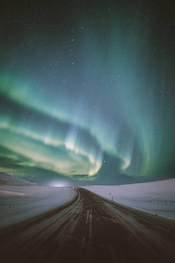 Stunningly Beautiful Snowy Road Northern Lights Wallpaper