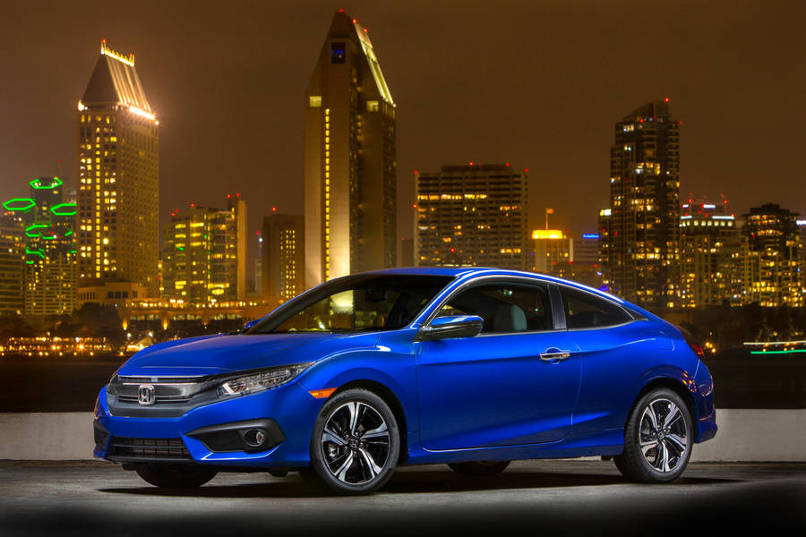 Stylish Blue 4k Honda Civic Illuminated By City Lights Wallpaper