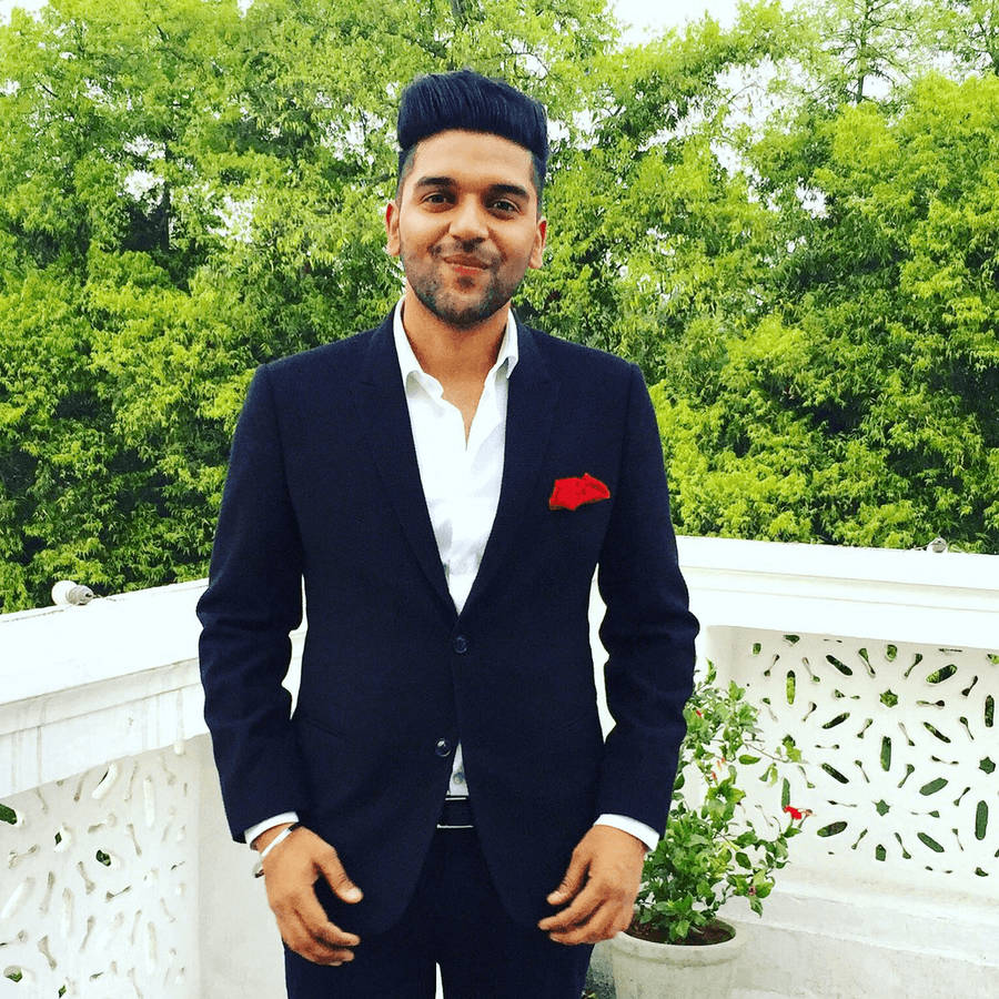 Stylish Guru Randhawa In Black Suit Wallpaper