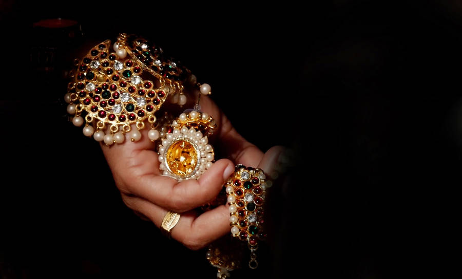 Sublime Elegance In Hand - Premium Jewelry Collection Wallpaper