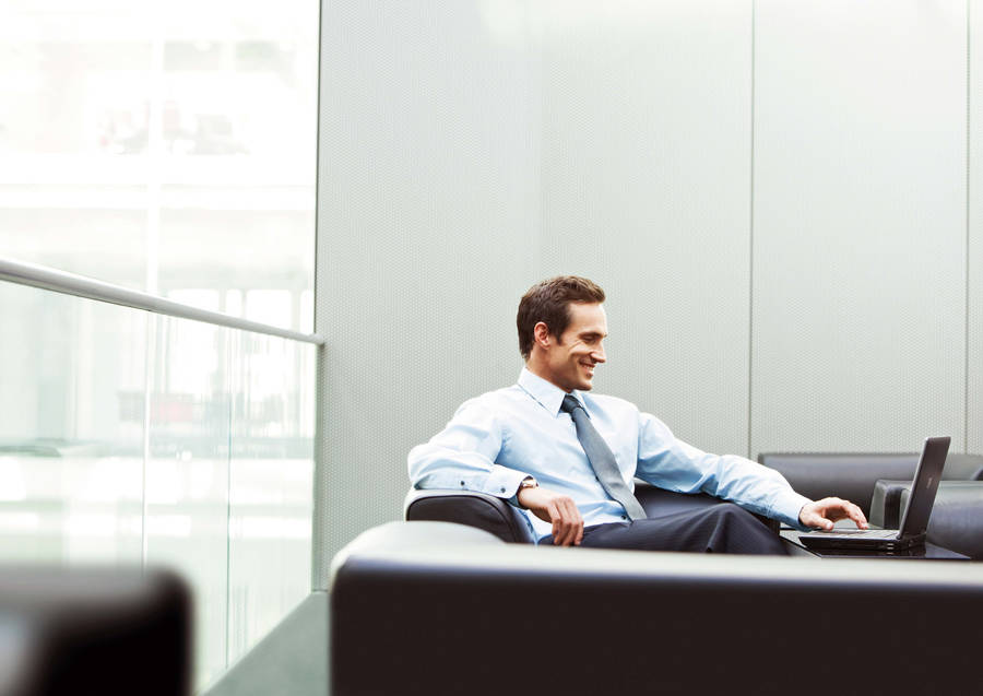 Successful Entrepreneur Contemplating Next Move In Office Wallpaper