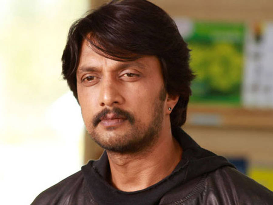 Sudeep Looking Intently Wallpaper