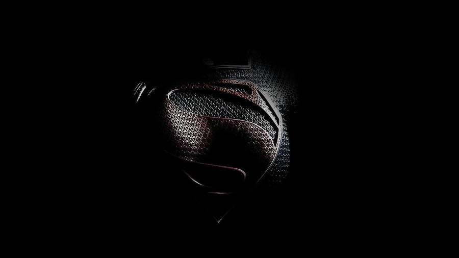 Superman Suit On Black Tablet Wallpaper