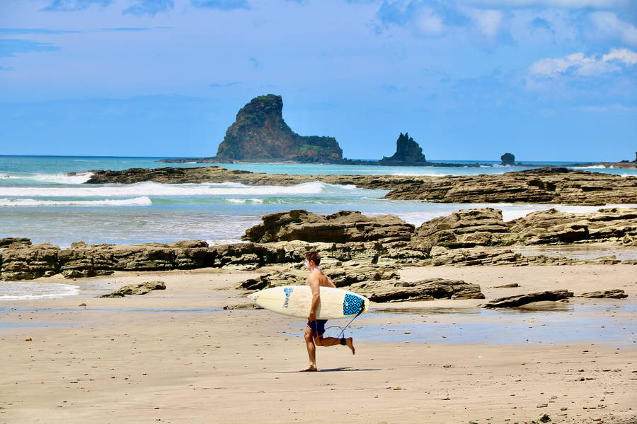 Surfer In Nicaragua Island Wallpaper