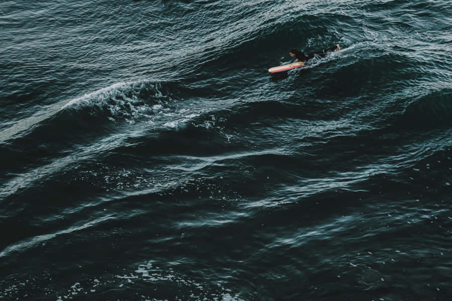 Surfer Not Overwhelmed By Waves Wallpaper