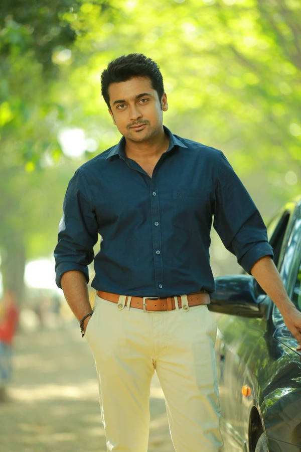 Surya Beside A Car Hd Wallpaper