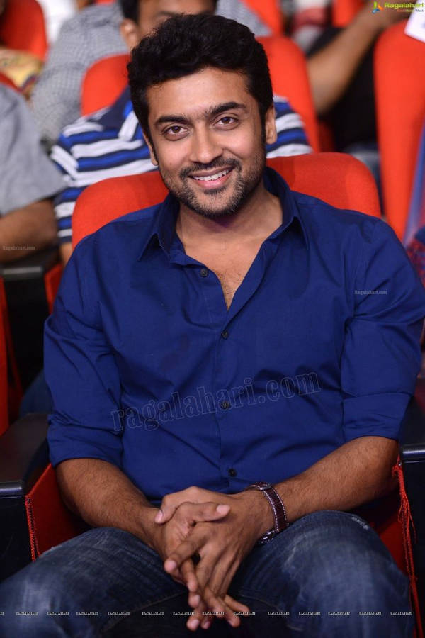 Surya Sitting And Smiling Hd Wallpaper