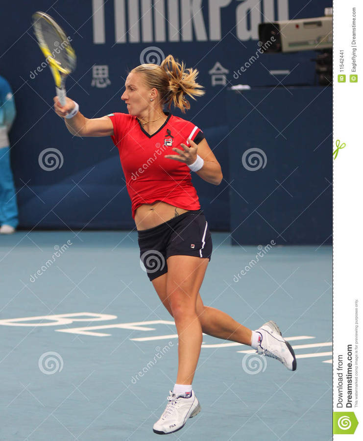 Svetlana Kuznetsova Swinging Racket Up Wallpaper