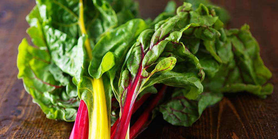 Swiss Chard Vegetables Atop Wooden Platform Wallpaper