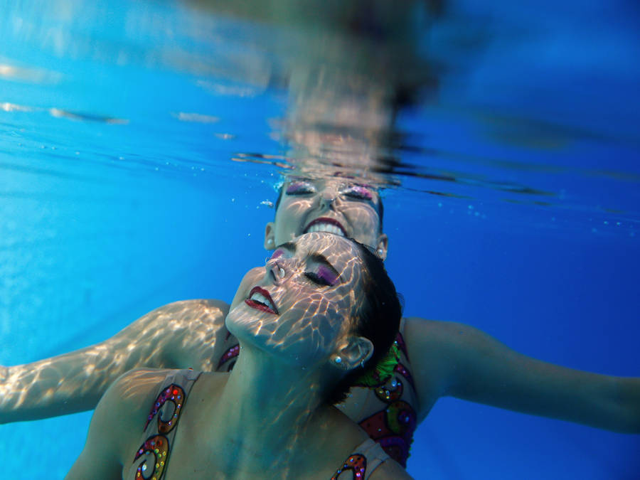 Synchronized Swimming Underwater Shot Wallpaper