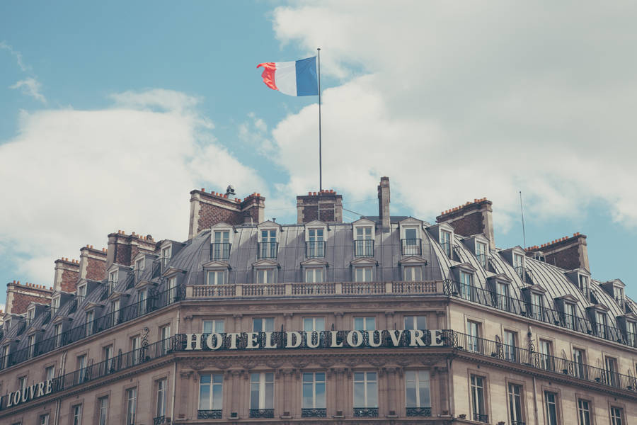 Take In The Stunning Views From The Majestic Hotel Du Louvre In Paris, France. Wallpaper