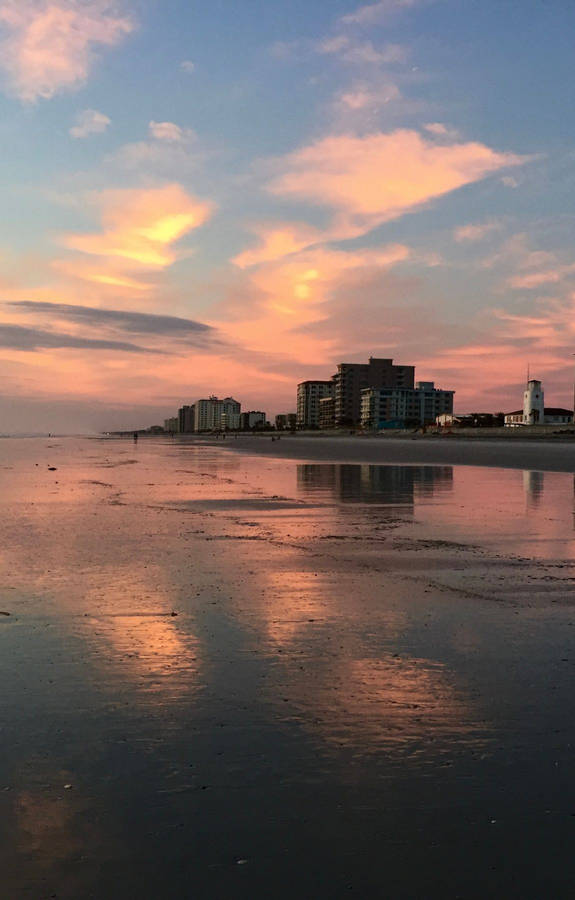 Tall Building On Beach Sunrise Wallpaper