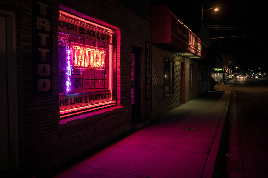 Tattoo Neon Sign In Window Wallpaper