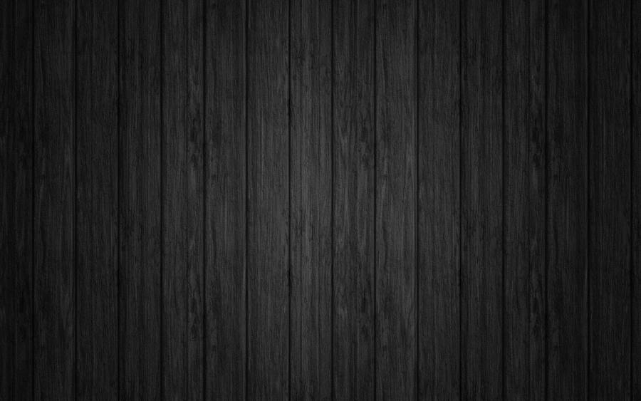 Tech Style - Black Mac On Wooden Table Wallpaper