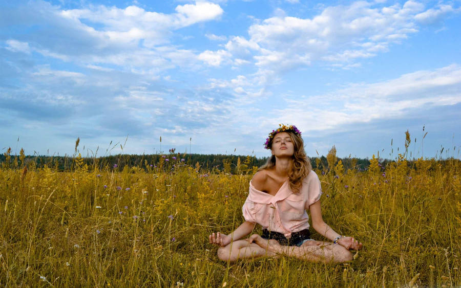 Teen Girl Embracing Tranquility Through Yoga Meditation Wallpaper