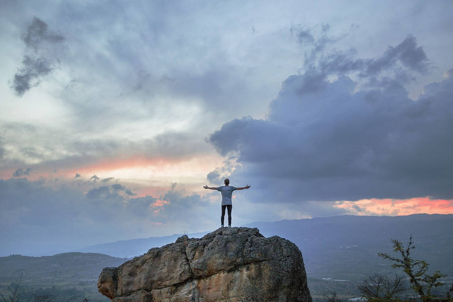 Tenacious Man Top Of The Mountain Wallpaper