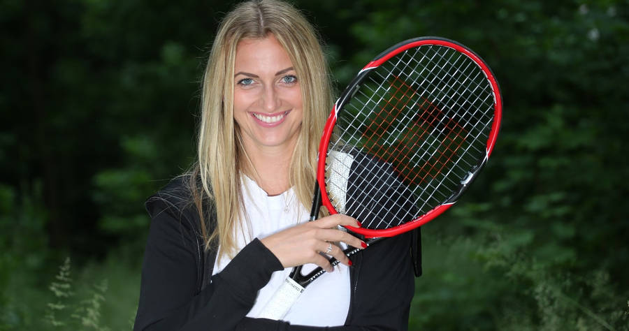 Tennis Champion - Petra Kvitova Holding Her Racket Wallpaper