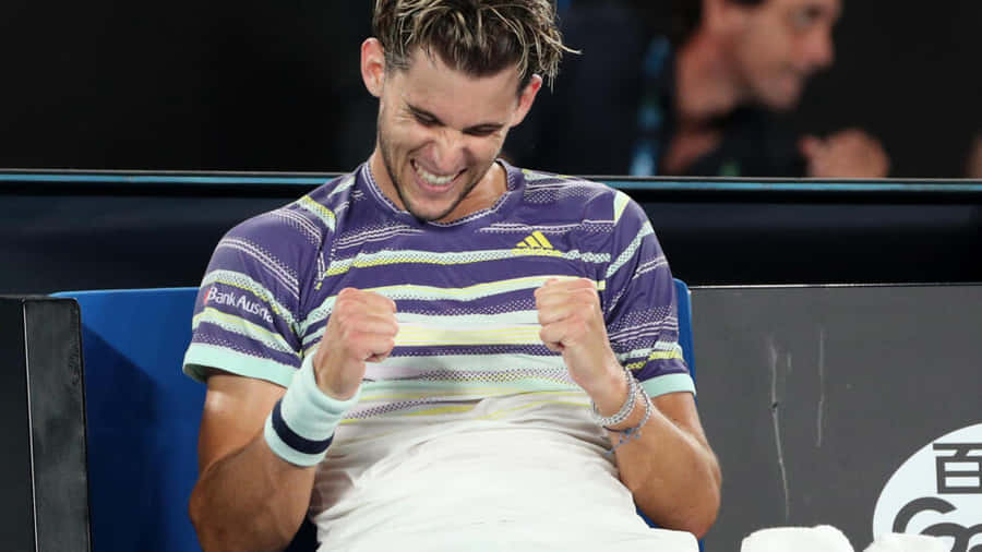 Tennis Player Celebrating Victory Wallpaper