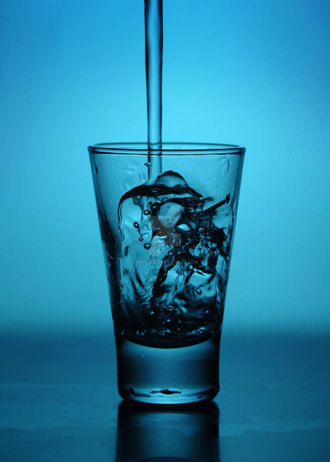 Tequila Pouring On Blue Glass Wallpaper