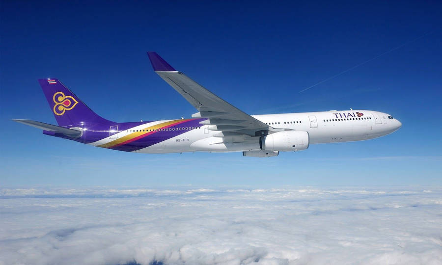 Thai Airways Plane Above Clouds Wallpaper