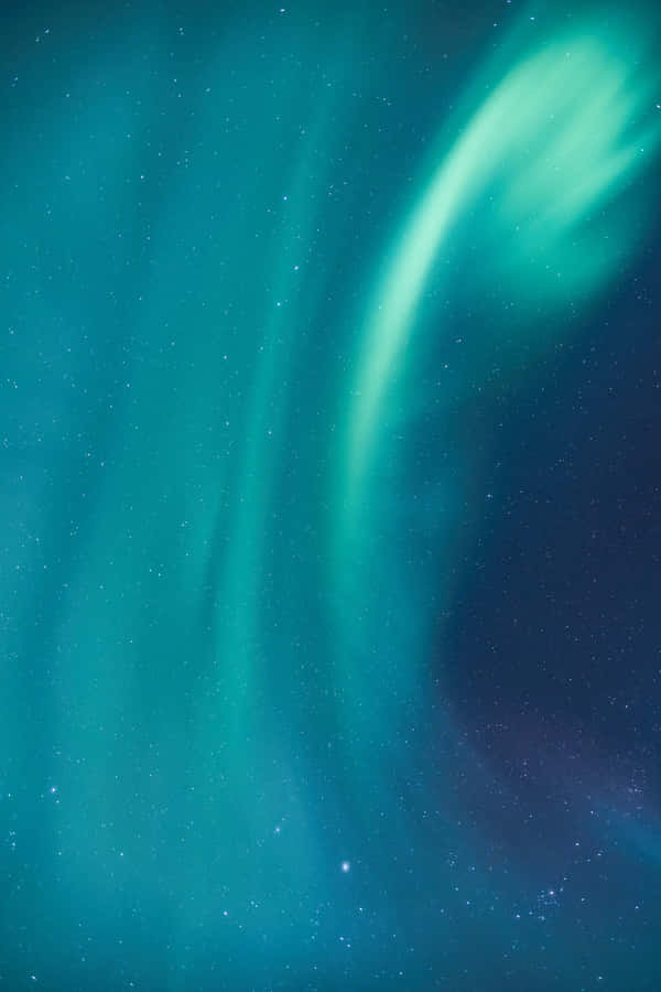 The Aurora Borealis Is Seen In The Sky Wallpaper