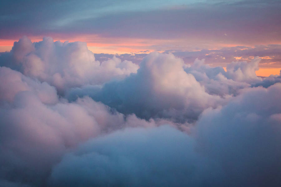 The Beauty Of A Clear Blue Sky And Soft, White, Heavenly Clouds Wallpaper