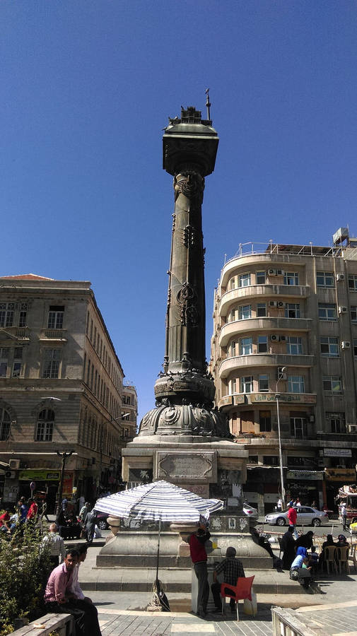 The Bustling Al-marjeh Square In Syria Wallpaper