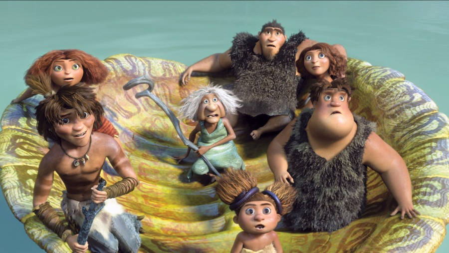 The Croods Family Adventuring On A Floating Device Wallpaper