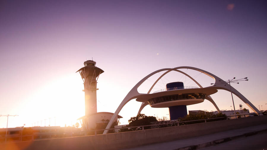 The Famous Los Angeles Theme Building At Lax, Illuminated By The Morning Sun Wallpaper