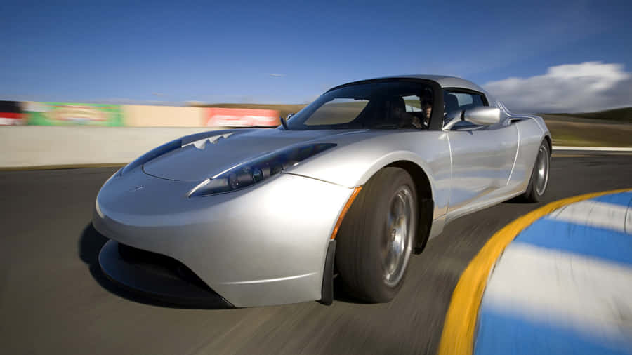 The Futuristic Tesla Roadster On A Riding Spree Wallpaper