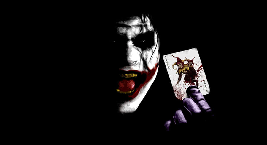 The Joker Laughing Maniacally In Darkness Wallpaper