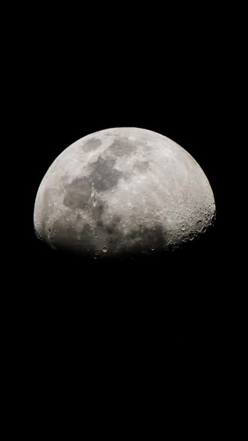 The Moon Is Seen In The Dark Sky Wallpaper