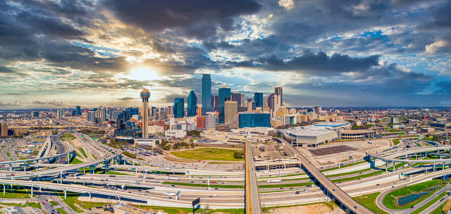 The Scenic Dallas Skyline, Illuminated By The Warm Texas Sun. Wallpaper