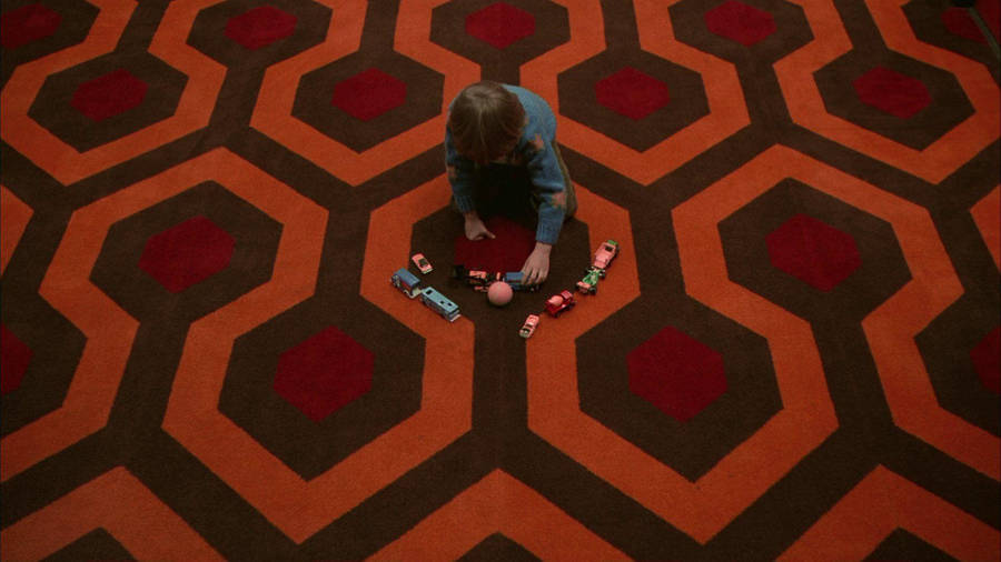 The Shining Danny Playing On Carpet Wallpaper