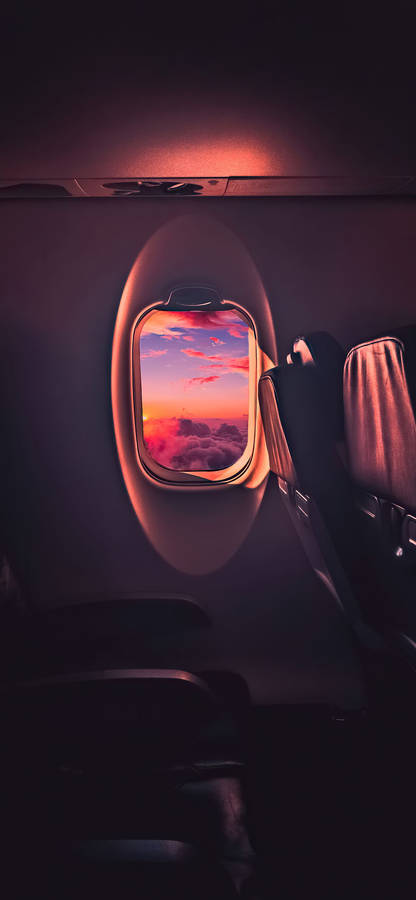 The Sun Shines On A Plane Window Wallpaper