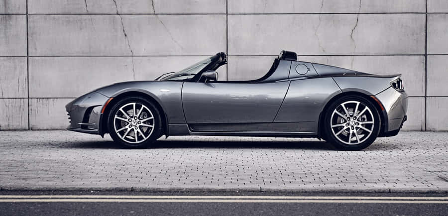 The Tesla Roadster - Electric Power Unleashed Wallpaper