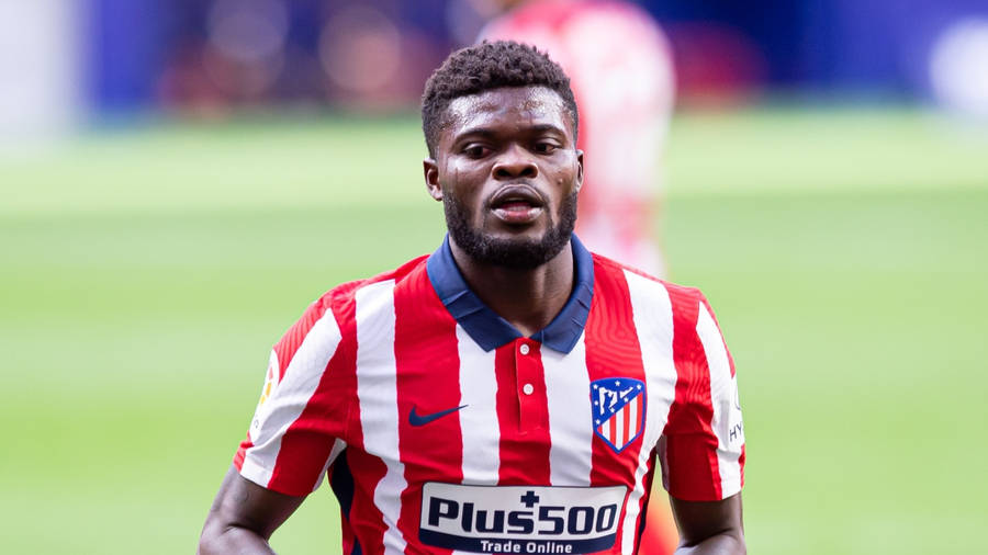 Thomas Partey In A Red And White Uniform Wallpaper